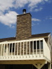 tri gray rr with accent rocks on chimney